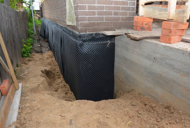 Happy homeowners after waterproofing job in Rensselaer